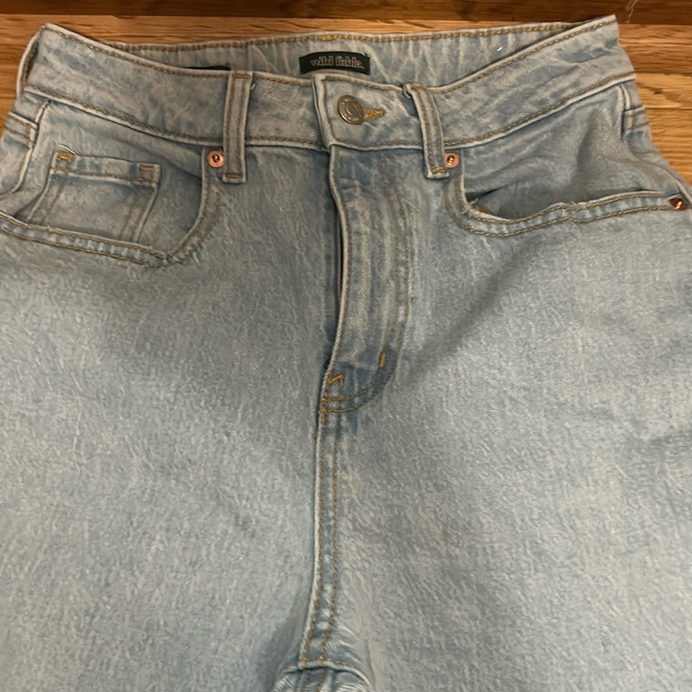 Light washed jeans. Holes at the knee. Size 0